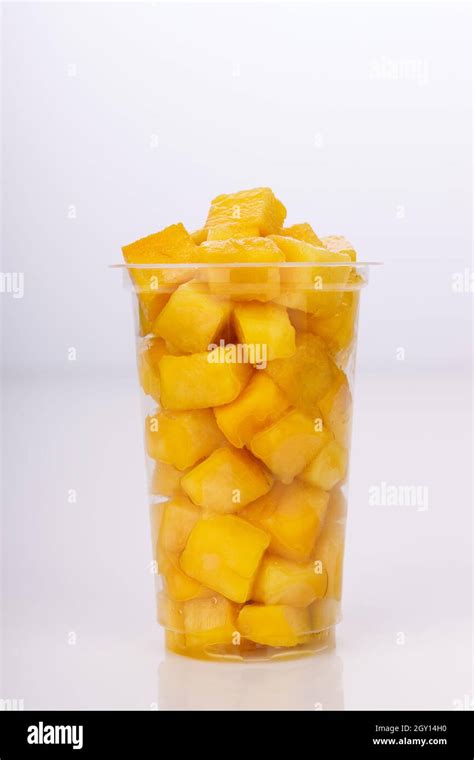 Ripe Mango Cubes Or Cut Piece Arranged In A Transparent Glass With