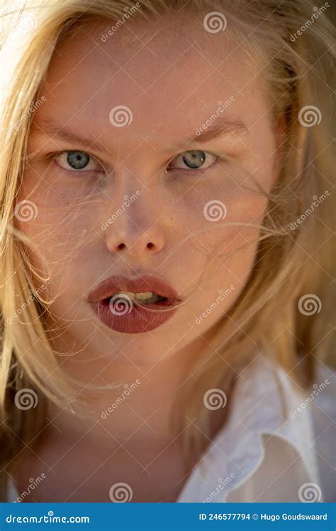 Perfect Imperfection Caucasian Curvy Model With Blonde Hair And White Shirt In Sunlight
