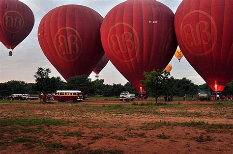 Red Air Balloons Fill Bagan Skies Over Ancient Temples Photo Background