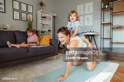 Pregnant Mother Exercising While Daughters Distract Her High Res Stock