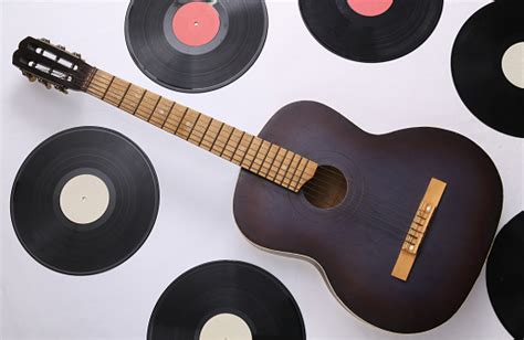 Acoustic Guitar Vinyl Records On White Background Musical Concept Top