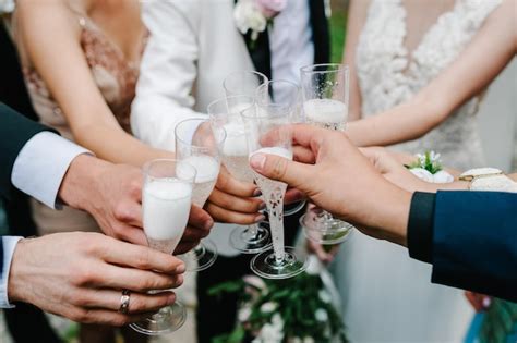 Premium Photo Cheers Newlyweds With Friends Drink Champagne Of The