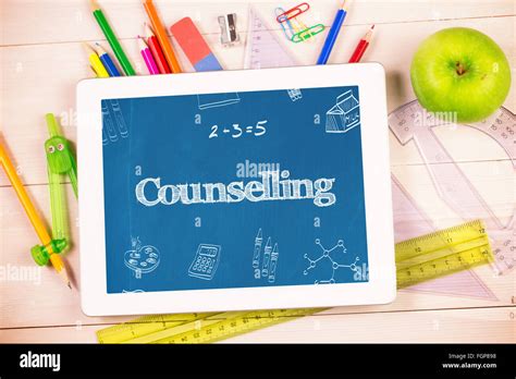 Counselling Against Students Desk With Tablet Pc Stock Photo Alamy