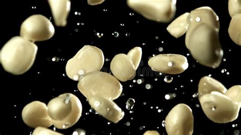 Garlic Flies Up With Drops Of Water Filmed On A High Speed Camera At