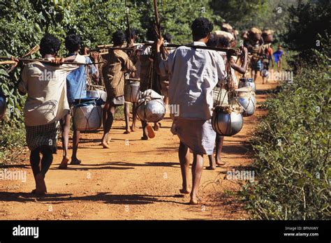 Bonda Tribal Men Carrying Pots To Weekly Market Onakadhalli