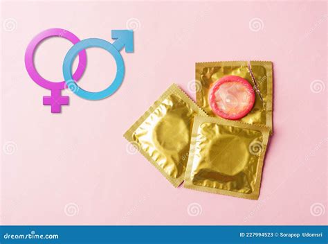 Condom In Wrapper Pack Tear Open And Male Female Gender Signs Stock Image Image Of Foil