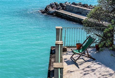 Balcony with a Sea view Photograph by Oliver Lynn - Pixels