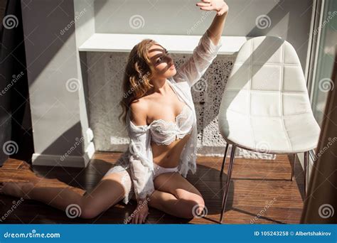 Beautiful Girl In Lingerie Sitting On A Sofa Stock Photo Image Of Lingerie Lace