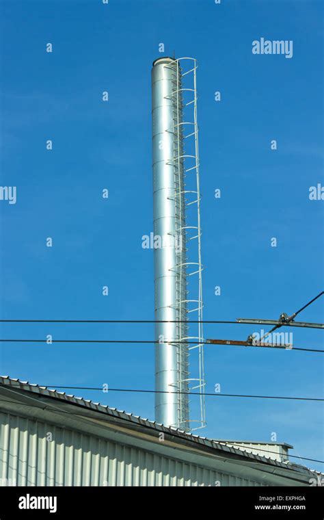 Industrial Chimney Over Blue Sky Stock Photo Alamy