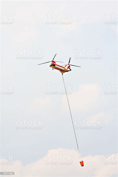 Helicopter With Water Drop Bucket Stock Photo Download Image Now