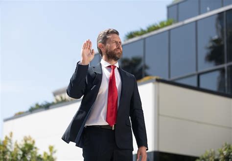 Premium Photo Handsome Man Businessman In Suit And Red Tie Outdoor