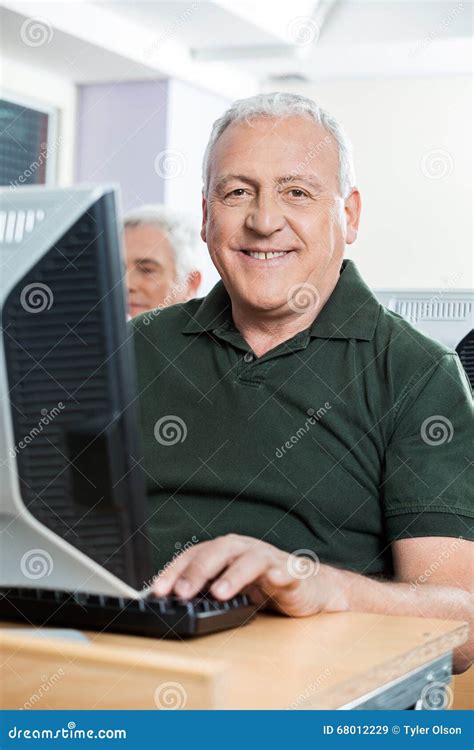 Happy Senior Man Sitting In Computer Classroom Stock Image Image Of