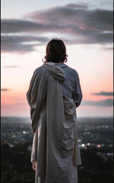 Premium Photo Back View Of Jesus Looking At The Sky