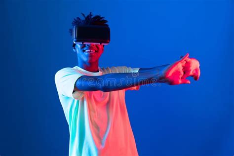 African Sport Player Wearing Vr Stretching Arm Neon Light Wall