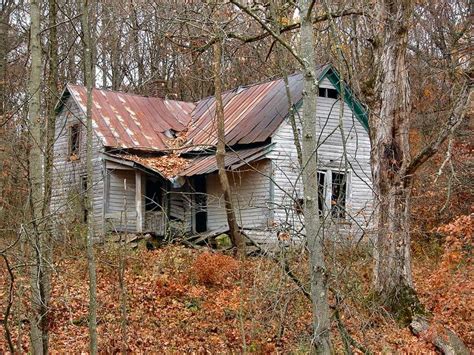 Abandoned Broken House On A Hillside