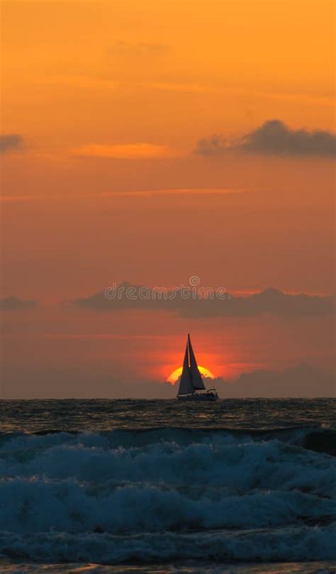 Yacht sailing at sunset stock image. Image of ship, sailing - 24489511