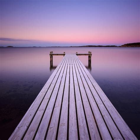 Premium Photo Wooden Frosty Jetty Leading Into The Sea Sweden