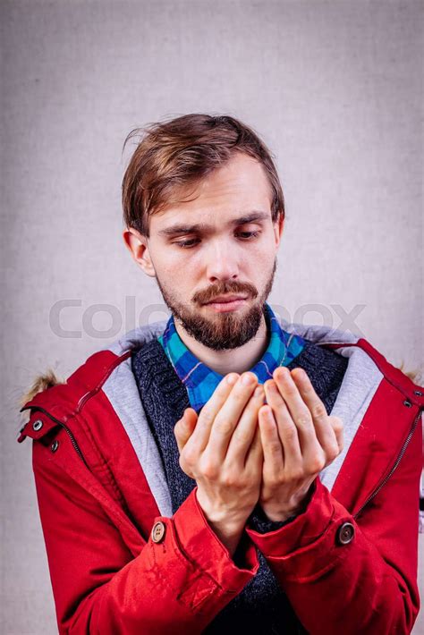 Man Holding Something In His Hands Stock Image Colourbox