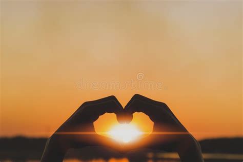 Silhouette Love Symbol Heart Symbol Hand In The Evening Sunset Stock