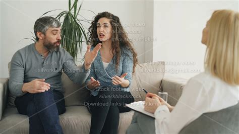 Married Couple Arguing And Quarreling During Visit Professional