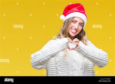 Beautiful Young Blonde Woman Wearing Christmas Hat Over Isolated