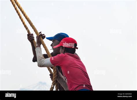 Unidentified Indian Fishermen Pull Out Their Chinese Fishing Net From