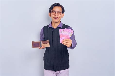 Premium Photo Cheerful Asian Young Man Wearing Shirt Holding Wallet