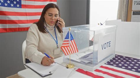 Hispanic Woman Polling Station Worker Multitasking In A Usa Election