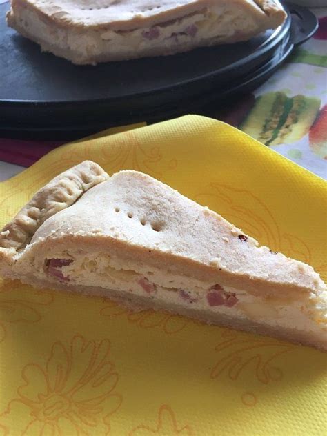 Two Pies Sitting On Top Of A Yellow Napkin Next To Each Other In Front