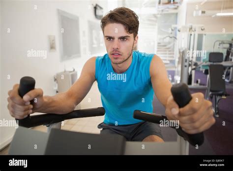 Focused Fit Man On The Exercise Bike Stock Photo Alamy