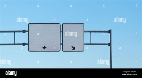 Two Overhead Blank Highway Signs Each Has Arrow Pointing Different