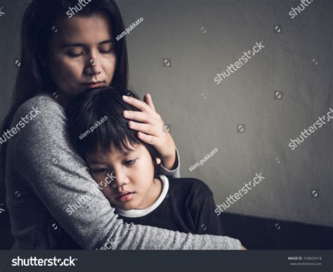 Sad Little Boy Being Hugged By Stock Photo 749829418 | Shutterstock