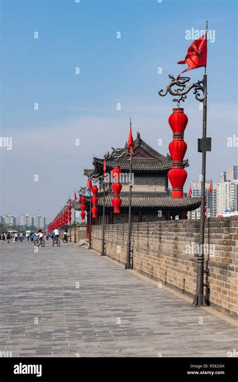 View Of Xian City Wall Ramparts With Modern City In Background Stock