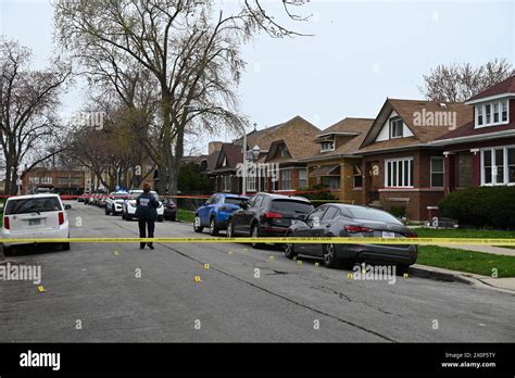 Chicago Police Officer Takes Photos Of Shell Casings On The Ground A