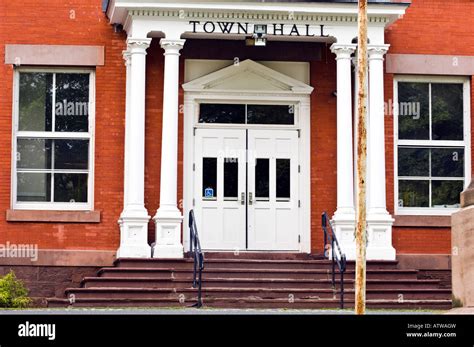 Town Hall Entrance With White Pillars And Crumbling Steps Handicap