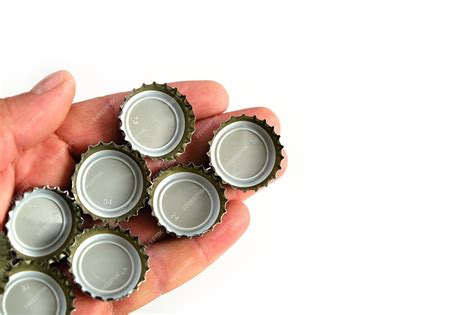 Premium Photo | Metal soda bottle caps soda caps closeup on white ...