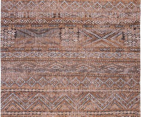 An Area Rug With Brown And Beige Colors