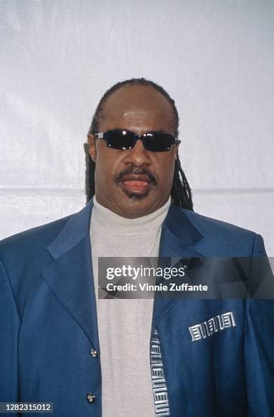 American Singer Songwriter And Musician Stevie Wonder Wearing A Blue