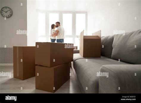 Cardboard Boxes With Kissing Couple At Background Moving Day Co Stock