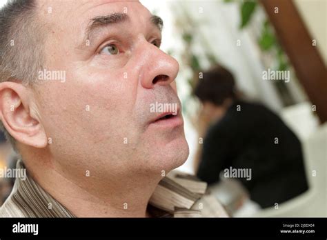 The Surprised Mature Man In A Restaurant Stock Photo Alamy