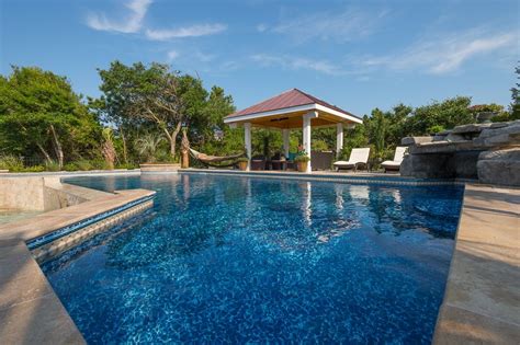 Emerald Isle Pool With Travertine Pool Deck Gazebo Waterfall And Outdoor Kitchen Pool