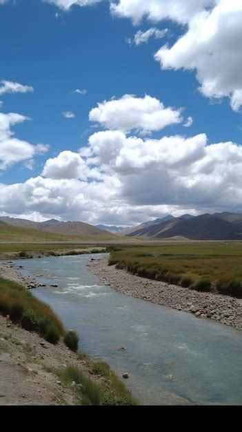 Um Rio Atravessa As Montanhas Ao Fundo Foto Premium