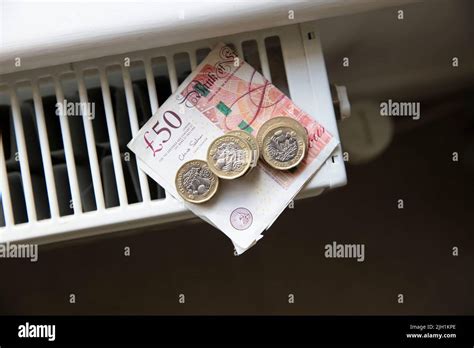 Cost Of Living Crisis Money On A Home Radiator Heater Rising Cost Of Energy And Bills Stock