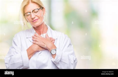 Middle Age Blonde Therapist Woman Wearing White Coat Over Isolated Background Smiling With Hands