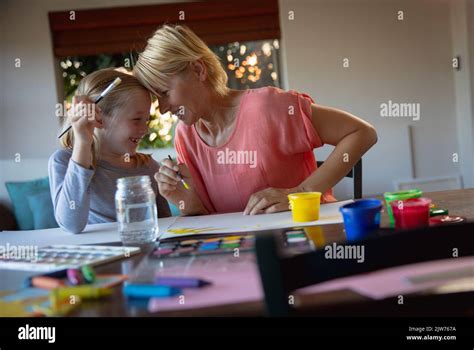 Mother And Daughter Painting Together Stock Photo Alamy