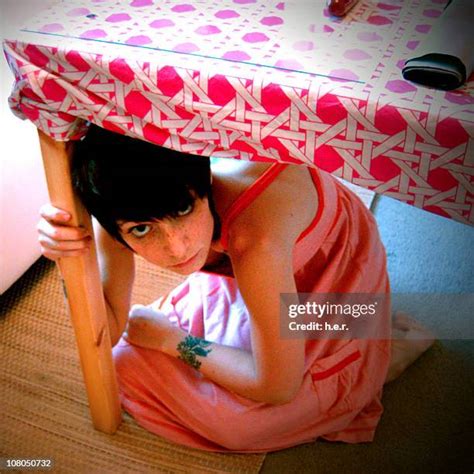 Woman Hiding Under Table Photos And Premium High Res Pictures Getty Images