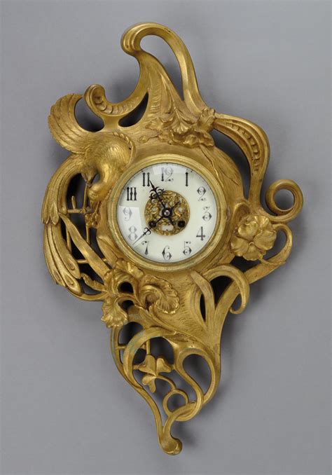 A Gold Patina Bronze Wall Clock With An Enamelled Metal Milestone Dial