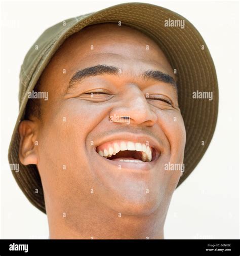 Close Up Of A Mid Adult Man Laughing With His Eyes Closed Stock Photo