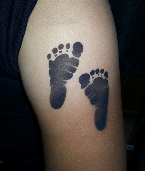 Imprint black baby foot tattoo for man - Tattooimages.biz