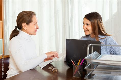 Mature Woman Filling Questionnaire For Employee Stock Photo Adobe Stock